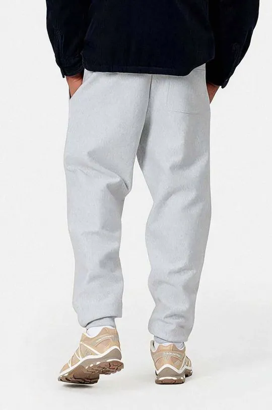 Carhartt WIP joggers American Script gray color